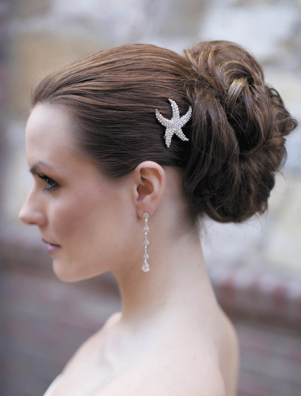An adorable cubic zirconia clear and silver starfish hair clip (style 7508) from Hair Comes the Bride. 